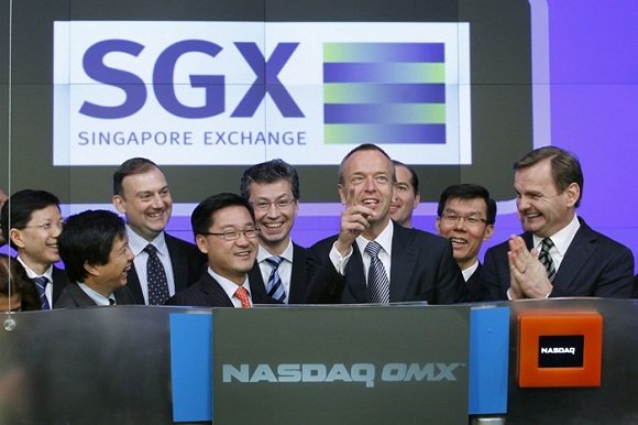 Magnus Bocker, CEO of Singapore Exchange, rings the opening bell at NASDAQ